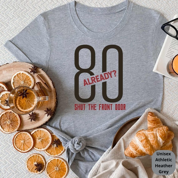 80 Already? Shut the Front Door! Celebrate a Lifetime of Memories with Our Funny 80th Birthday Shirt