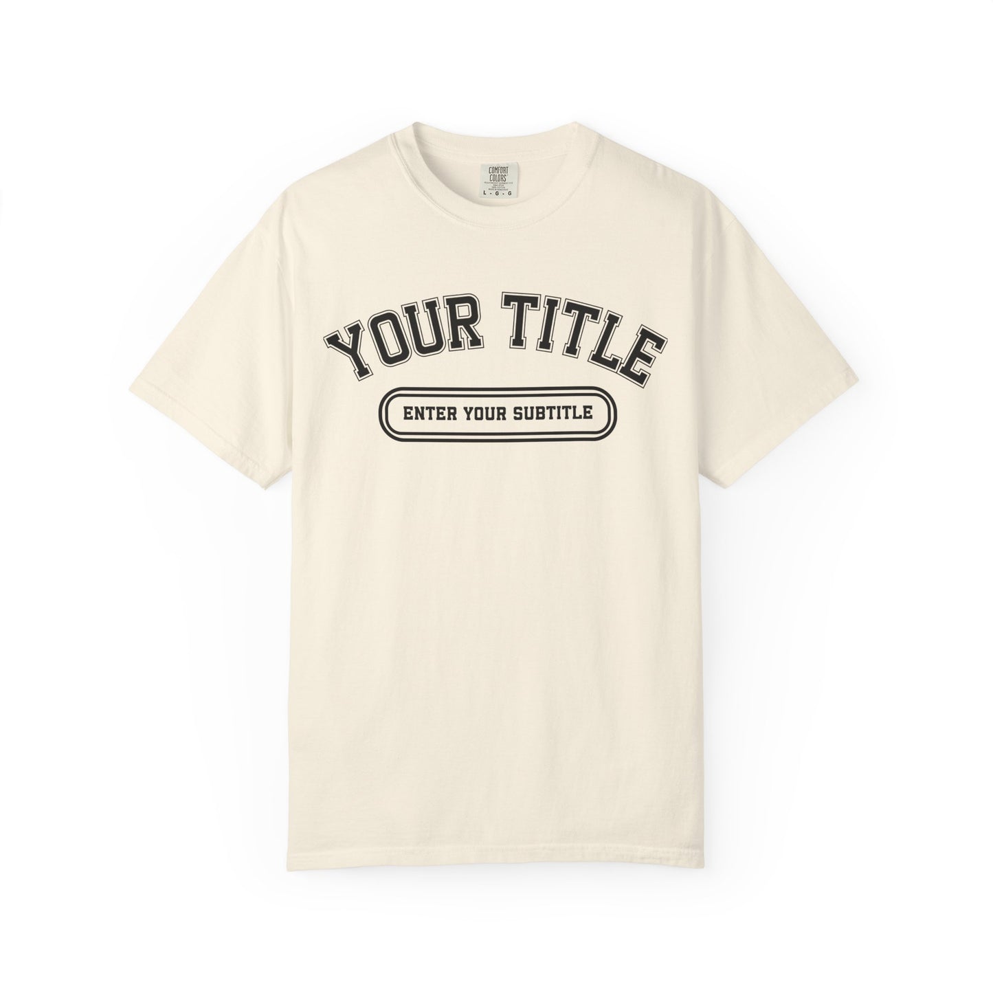 An off-white short-sleeve t-shirt with a black varsity-style graphic on the chest reading 'YOUR TITLE' and 'ENTER YOUR SUBTITLE', shown on a plain white background.